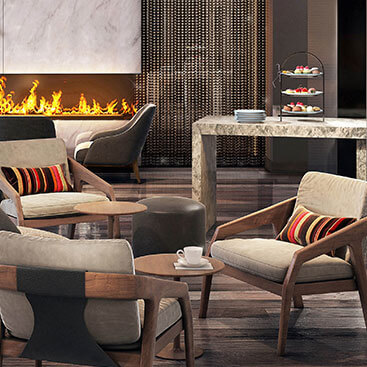 lounge area with tan chairs and fireplace